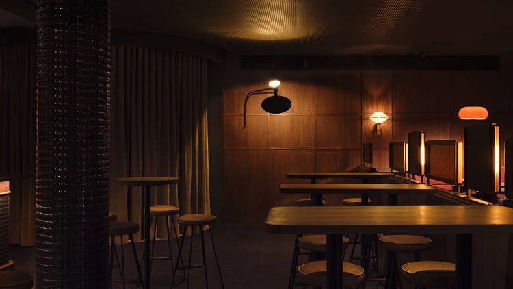 Dimly lit bar and restaurant interior.