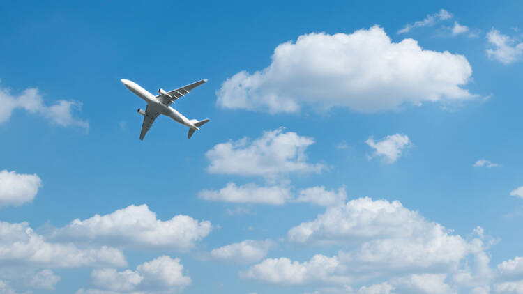 Luggage And Airplane On Beautiful Sky Travel Concept Stock Photo