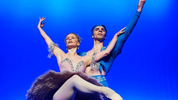 A man and woman dancer from the Kyiv City Ballet performing on stage 