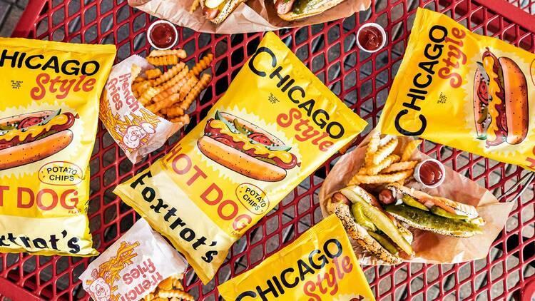 hot dog potato chips next to hot dogs and fries