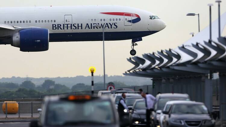 Plane and taxis at Heathrow Airport, London