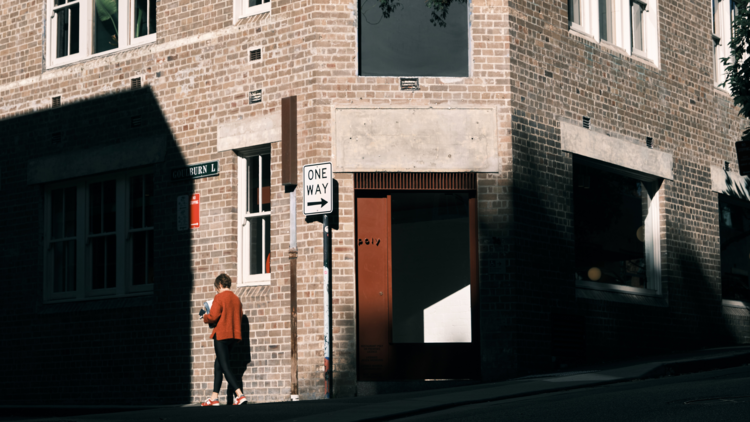 The facade of a light brick building