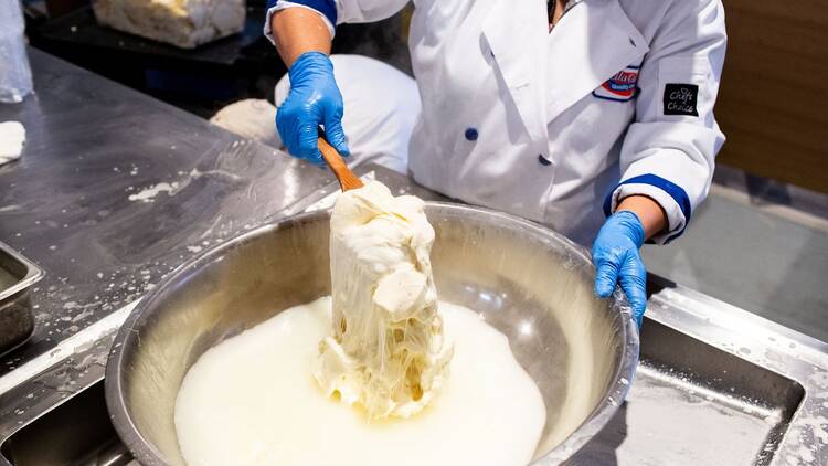 Person making mozzarella