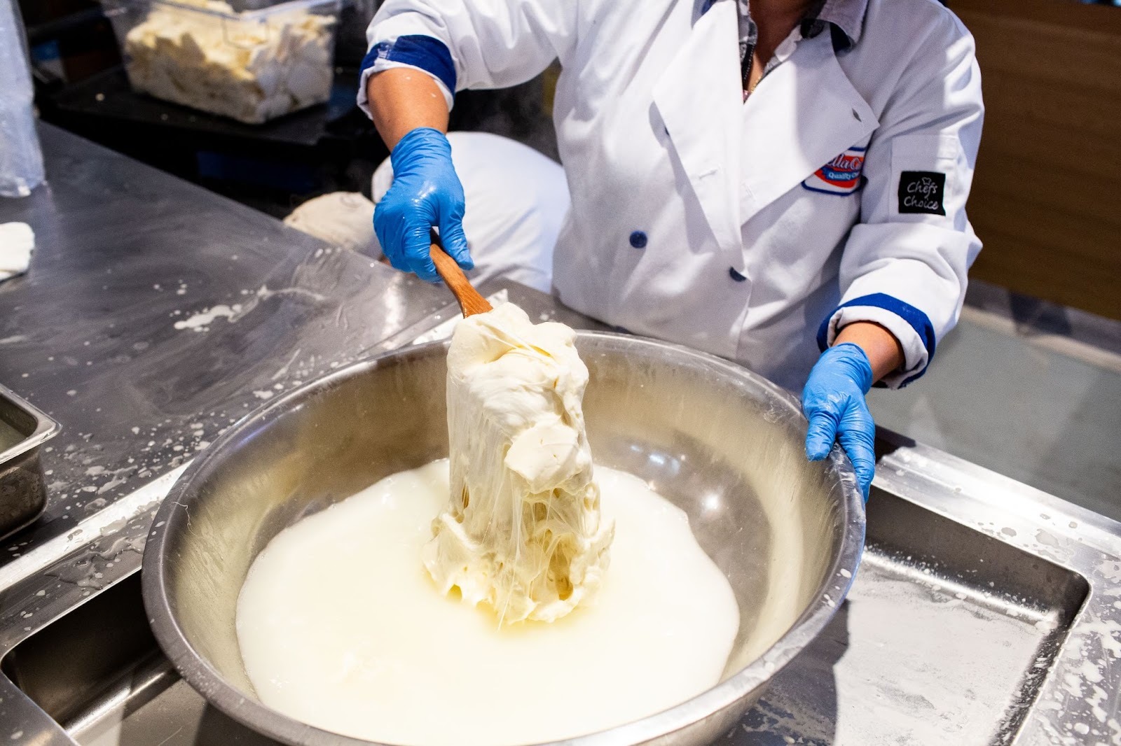 Person making mozzarella