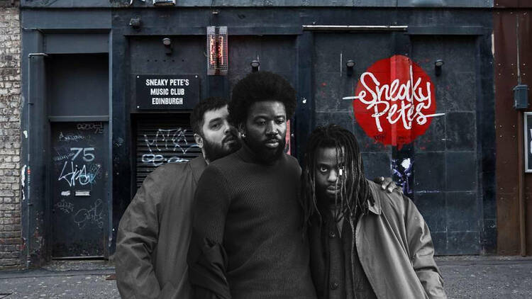  Young Fathers standing in front of Sneaky Petes