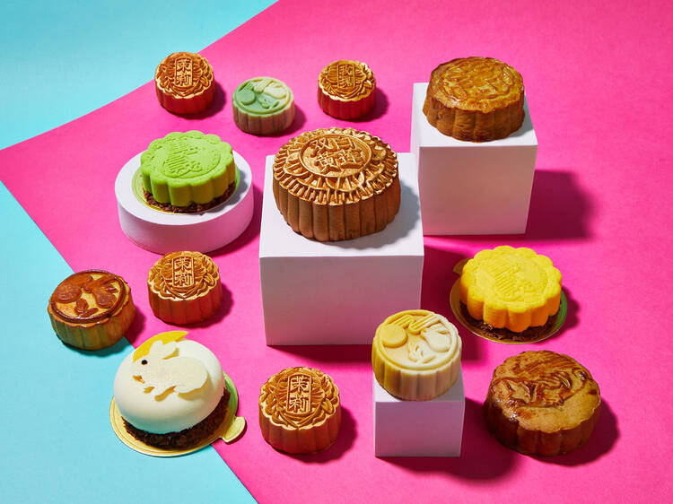 A selection of delicious looking mooncakes on a colourful backdrop 