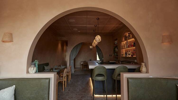 The inside of Iberica with a beautiful curved archway 