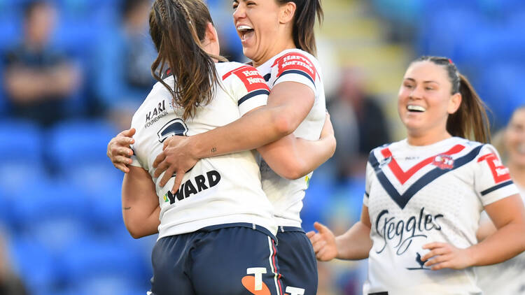 Sydney Roosters NRLW players hugging to celebrate