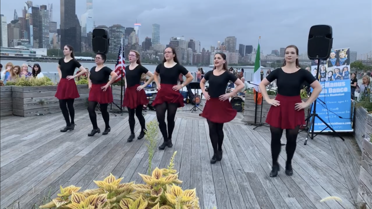 Dancers perform an Irish dance.