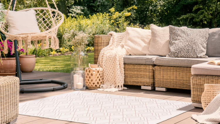 A patio featuring an outdoor rug