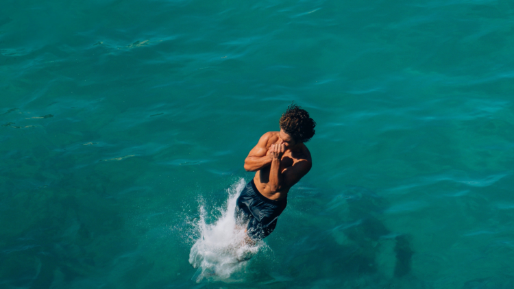 A man diving into the water