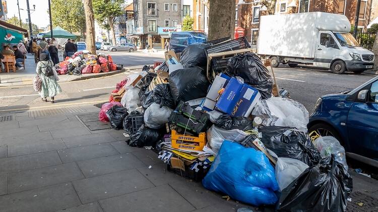Piles of rubbish after industrial action by street cleaners in Tower Hamlets, London
