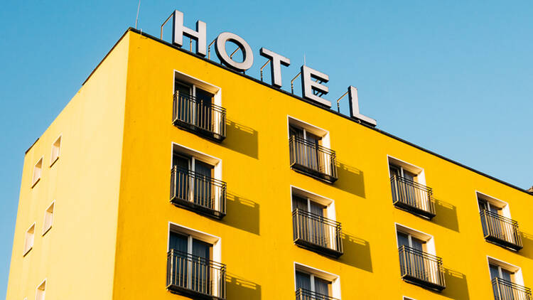 Yellow hotel building and sign