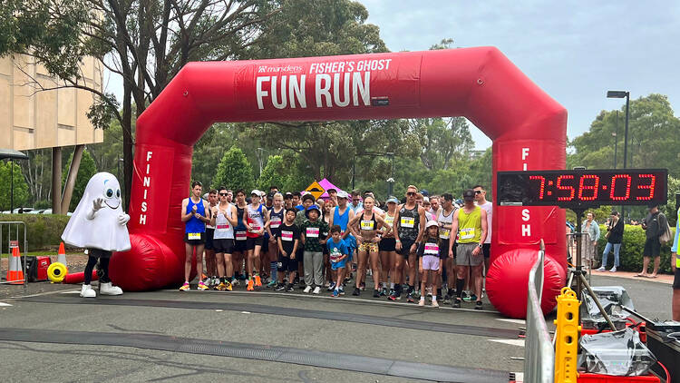 A crowd at a start line at a fun run