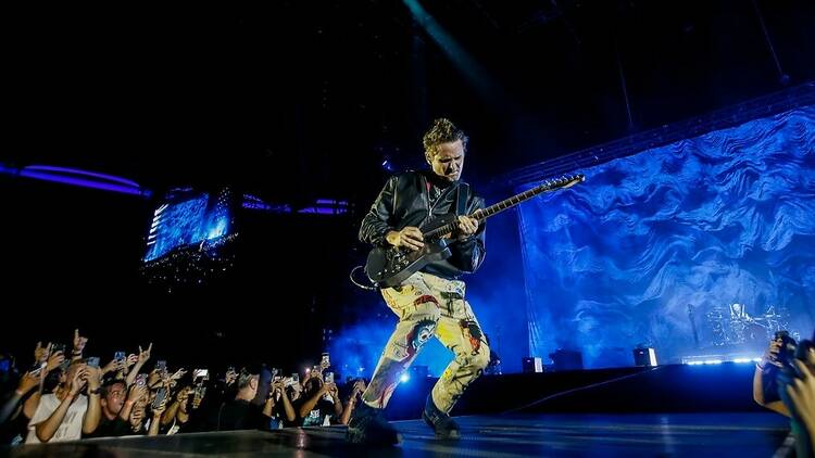 Muse guitarist and lead singer Matt Bellamy performing live