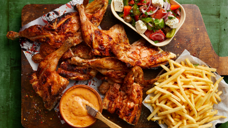 Charcoal chicken with chips and Greek salad