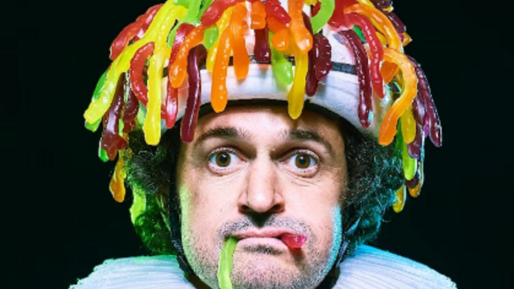 picture of the comedian garry starr wearing a hat made of jelly babies