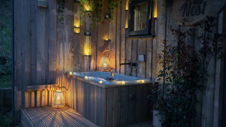 A cozy cabin with an outdoor bath