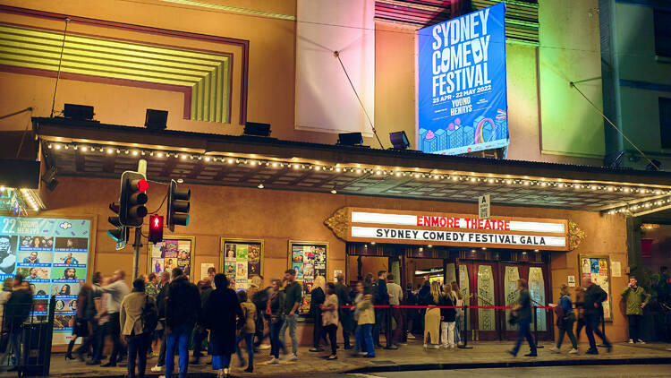 People standing outside a theatre