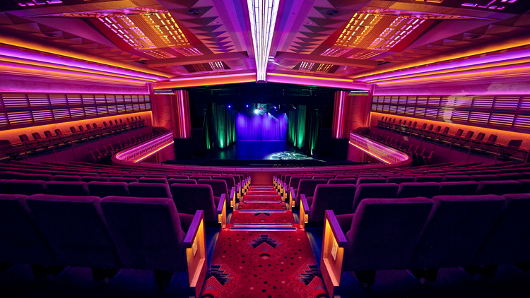 A neon lit auditorium