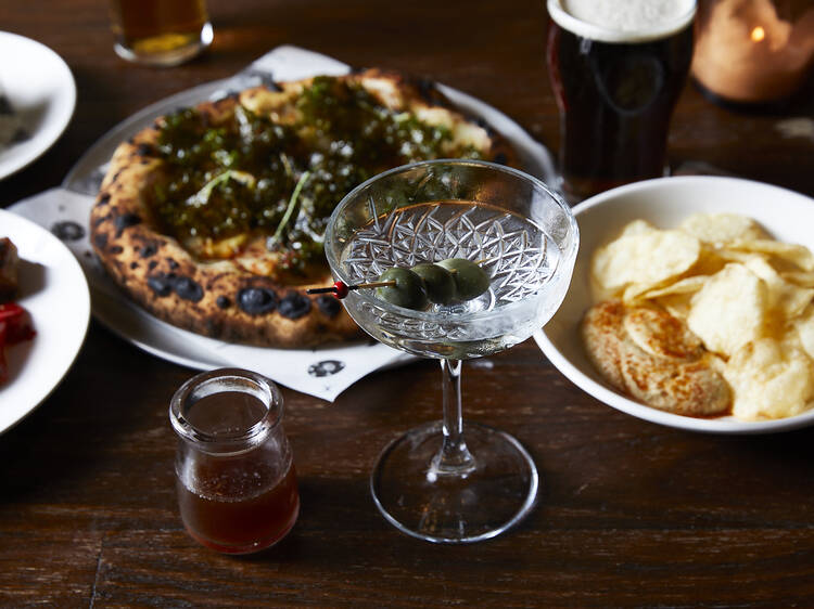 A martini amongst a food spread