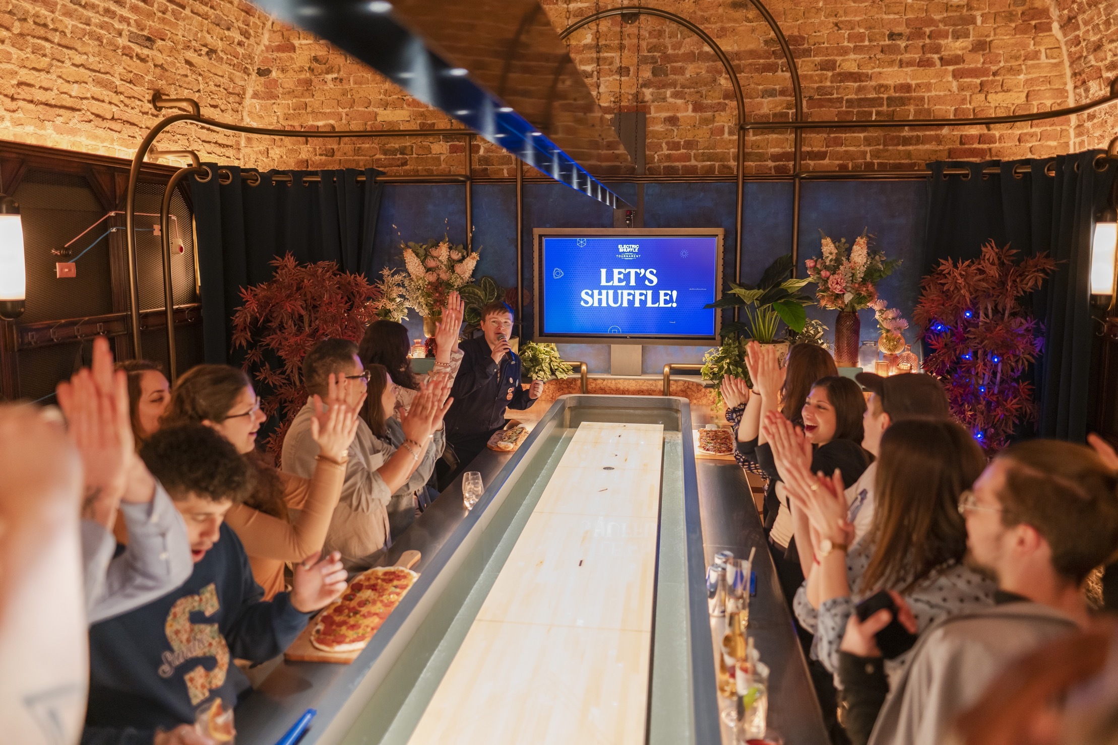 Electric Shuffle is a London-based shuffleboard bar opening in NYC