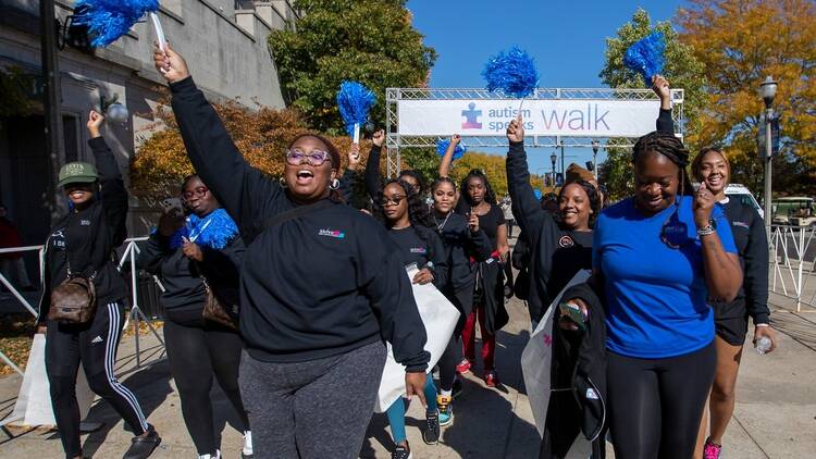 People marching at autism speaks walk