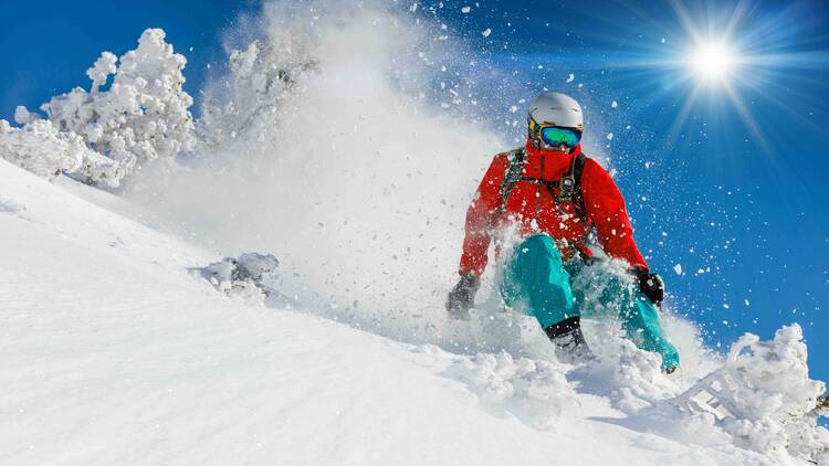 A skier going down a mountain