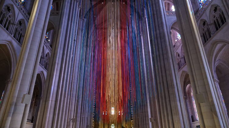 Ribbons hang down in a church.