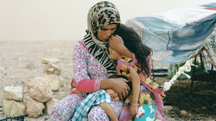 A mum and daughter hugging 