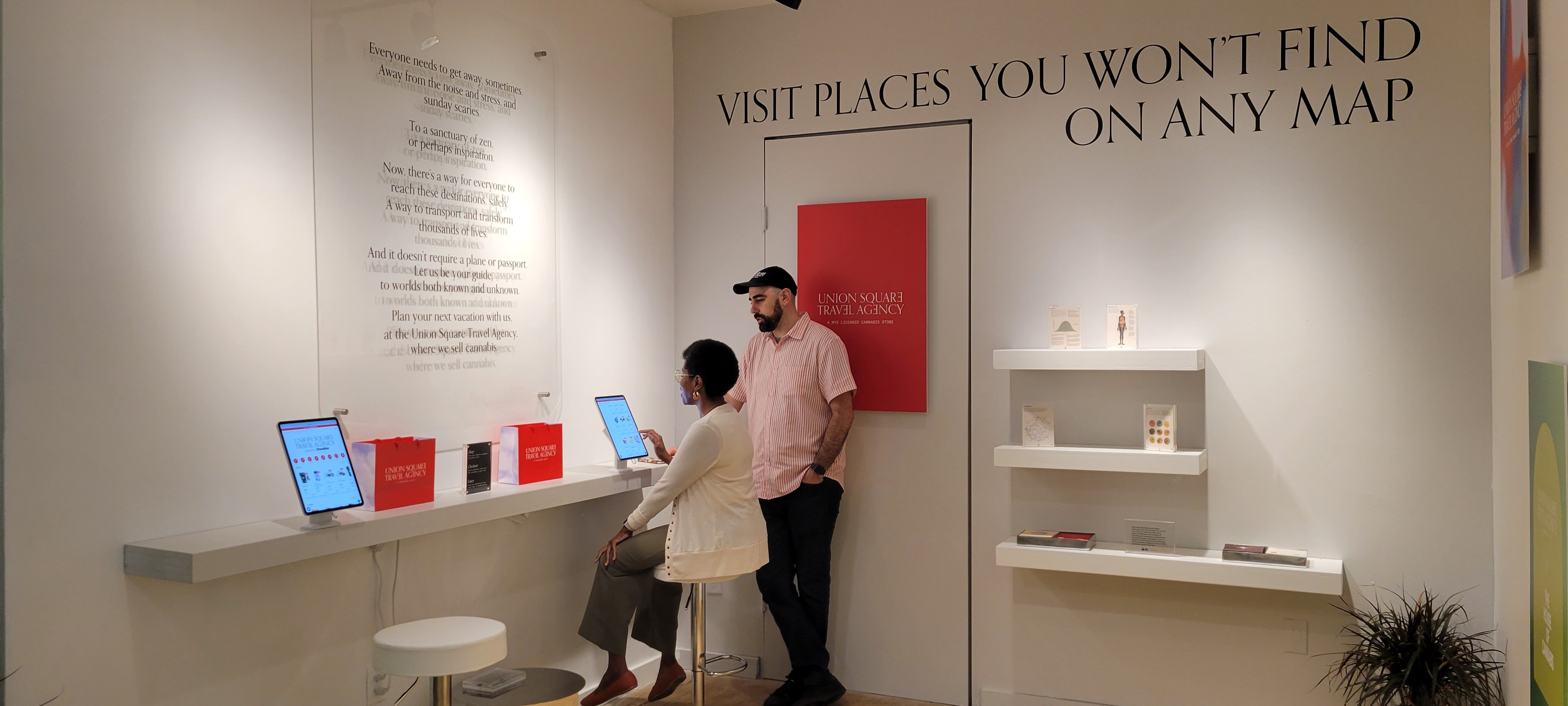 A woman sits at the ordering kiosk.