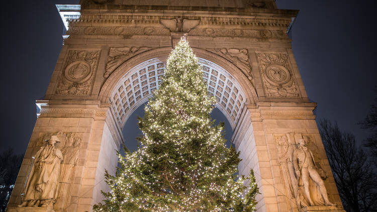 A large Christmas tree at the Washington Square Park arch.