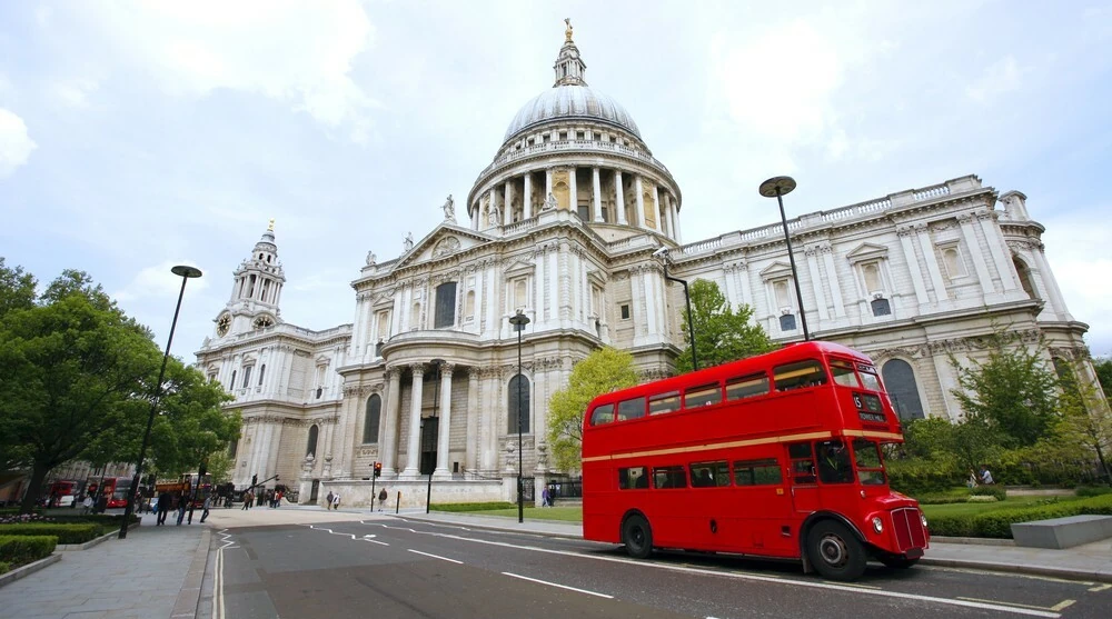 Vintage red Routemaster bus in front of St Paul's Cathedral