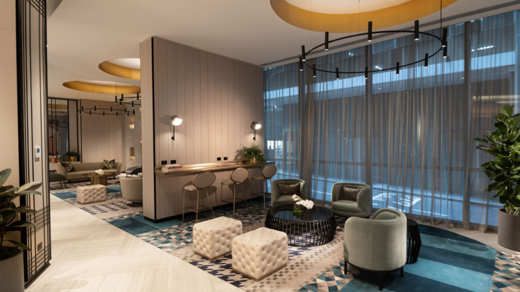 Shared area at Dorsett Melbourne with plush ottomans