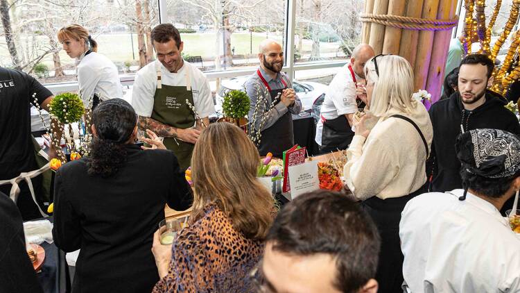 Chefs cooking for guests at an event