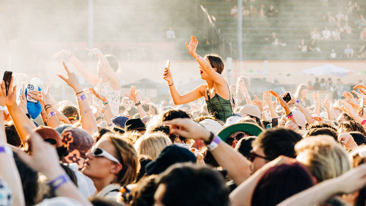 A crowd of people at a festival. 