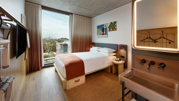 A double bed hotel room with city view