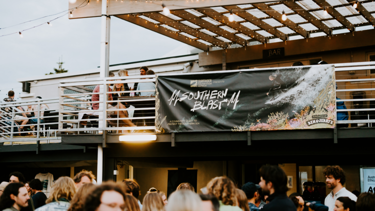 People at outdoor surf film screening