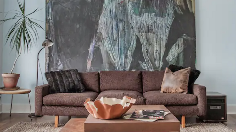 lounge with brown sofa and coffee table in  Hudson townhouse 