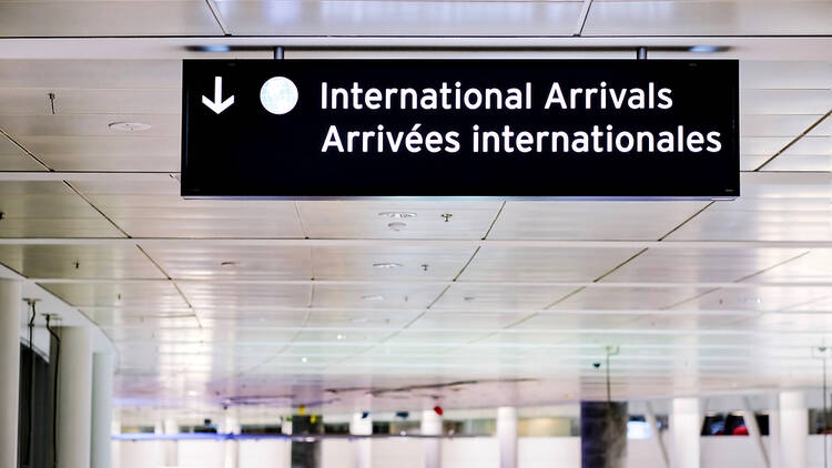 International Arrivals sign in a French airport