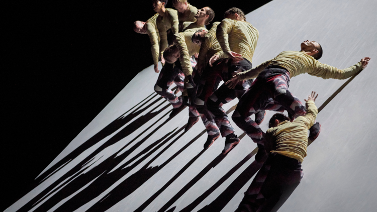 Dancers sliding down a 34 degree floor