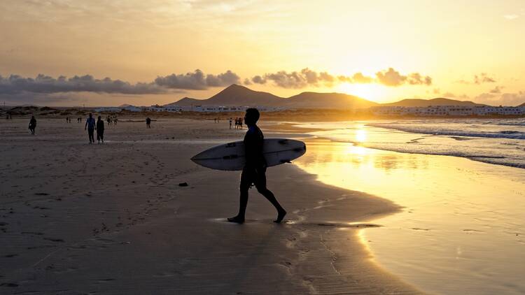 Body,Surfer,At,Famara,Beach,,Famara,Mountains,,La,Caleta,De