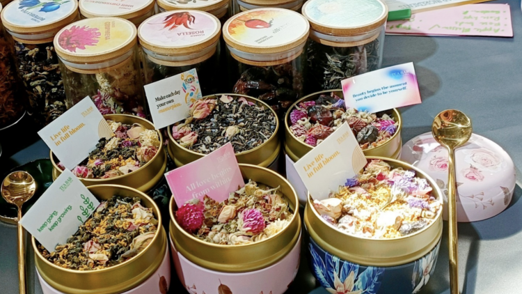 Various jars filled with blooming tea balls