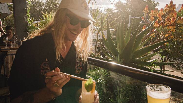 A guy having some cocktails at Stowaway