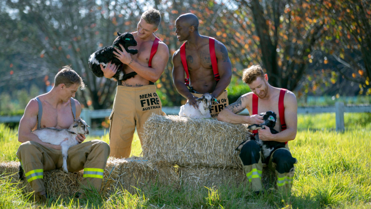 men in firemans outfits with goats