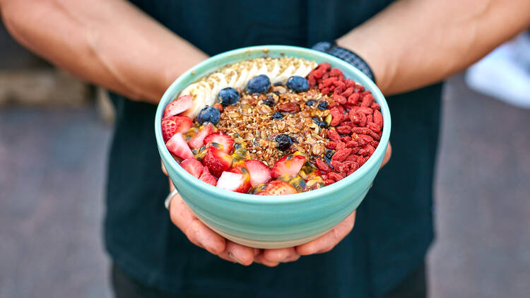 An acai bowl in a blue bowl