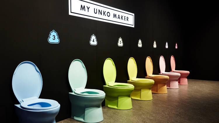 A row of colourful toilets. 