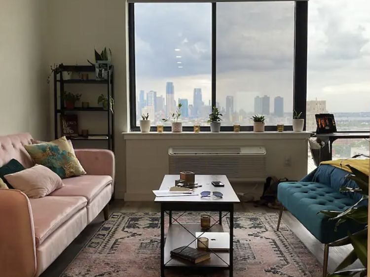 A stylish monthly rental with skyline views near PATH