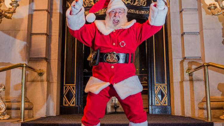 Santa jumps for joy outside of The Plaza.