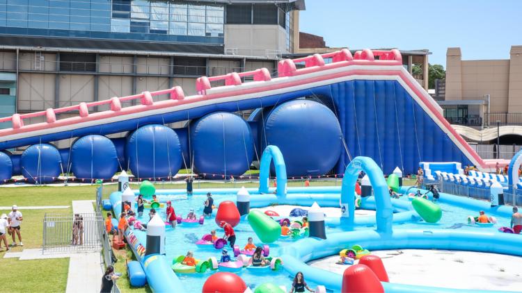 A waterpark with inflatable slides and pools
